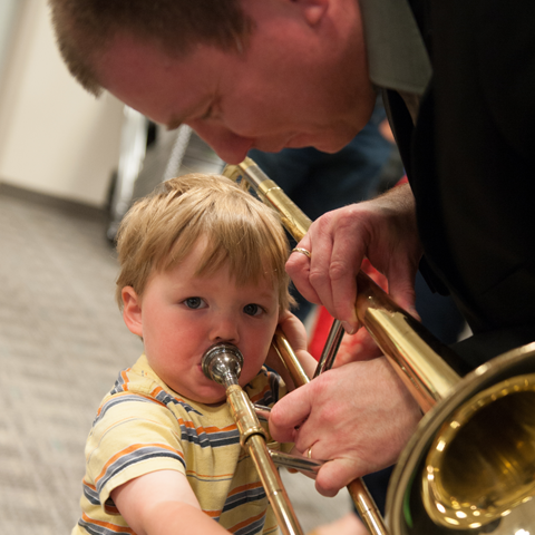 Symphony Principal Trombone Kip Hickman works with young student